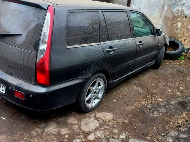 Серый Мицубиси Лансер, объемом двигателя 1.6 л и пробегом 234 тыс. км за 2500 $, фото 9 на Automoto.ua