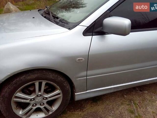 Сірий Міцубісі Lancer, об'ємом двигуна 2 л та пробігом 352 тис. км за 3950 $, фото 4 на Automoto.ua