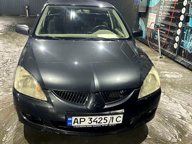 Серый Мицубиси Лансер, объемом двигателя 1.6 л и пробегом 234 тыс. км за 2500 $, фото 4 на Automoto.ua