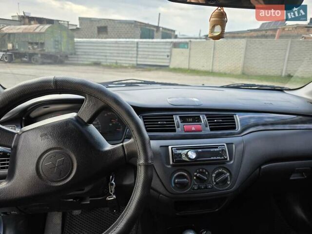Сірий Міцубісі Lancer, об'ємом двигуна 1.6 л та пробігом 244 тис. км за 4300 $, фото 7 на Automoto.ua