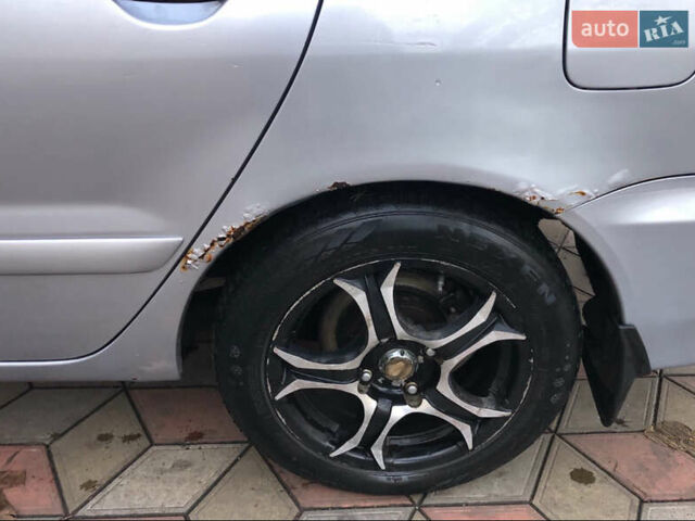 Серый Мицубиси Лансер, объемом двигателя 1.58 л и пробегом 240 тыс. км за 3500 $, фото 5 на Automoto.ua