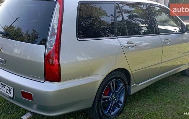 Серый Мицубиси Лансер, объемом двигателя 1.58 л и пробегом 231 тыс. км за 4500 $, фото 8 на Automoto.ua