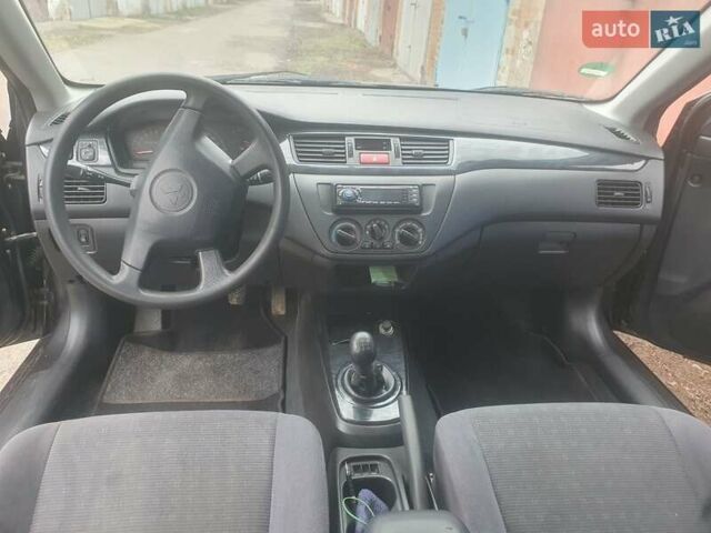 Сірий Міцубісі Lancer, об'ємом двигуна 1.6 л та пробігом 237 тис. км за 4800 $, фото 9 на Automoto.ua