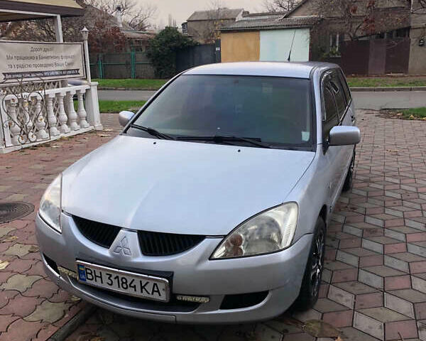 Серый Мицубиси Лансер, объемом двигателя 1.58 л и пробегом 240 тыс. км за 3500 $, фото 2 на Automoto.ua