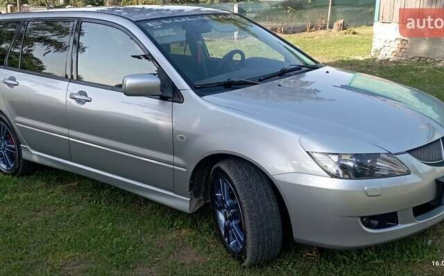 Серый Мицубиси Лансер, объемом двигателя 1.58 л и пробегом 231 тыс. км за 4500 $, фото 5 на Automoto.ua