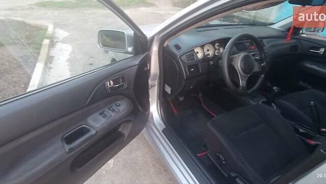 Серый Мицубиси Лансер, объемом двигателя 1.58 л и пробегом 231 тыс. км за 4500 $, фото 3 на Automoto.ua