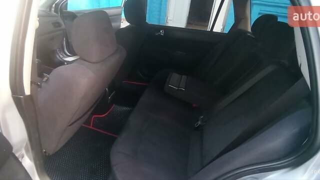 Серый Мицубиси Лансер, объемом двигателя 1.58 л и пробегом 231 тыс. км за 4500 $, фото 2 на Automoto.ua