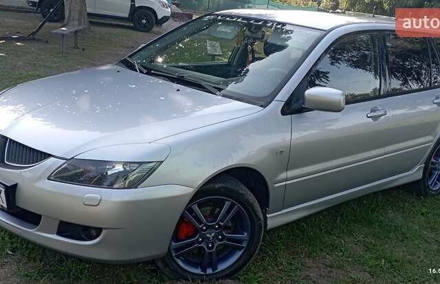 Серый Мицубиси Лансер, объемом двигателя 1.58 л и пробегом 231 тыс. км за 4500 $, фото 9 на Automoto.ua