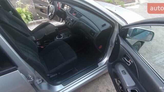 Серый Мицубиси Лансер, объемом двигателя 1.58 л и пробегом 231 тыс. км за 4500 $, фото 1 на Automoto.ua