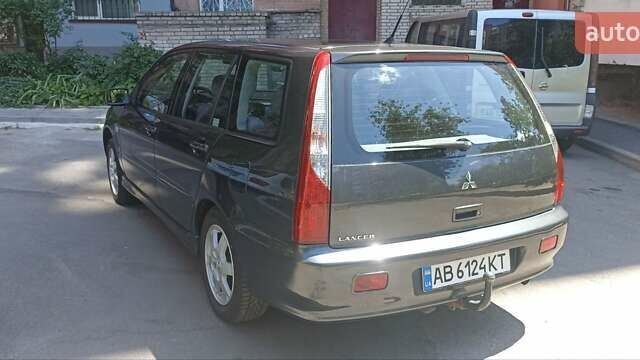 Серый Мицубиси Лансер, объемом двигателя 1.6 л и пробегом 244 тыс. км за 4600 $, фото 21 на Automoto.ua