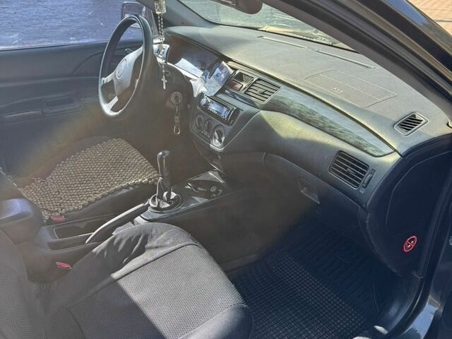 Сірий Міцубісі Lancer, об'ємом двигуна 1.6 л та пробігом 261 тис. км за 2900 $, фото 4 на Automoto.ua