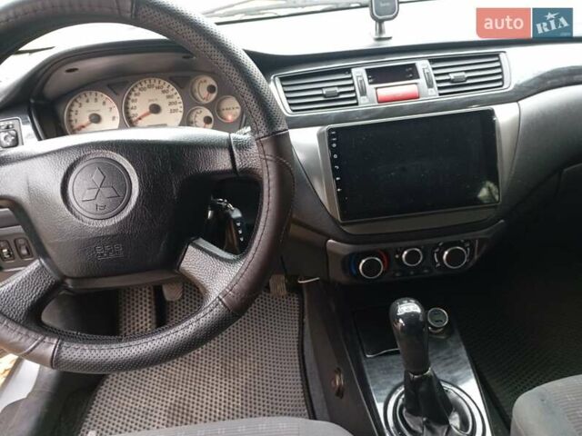 Міцубісі Lancer 2004 у Запоріжжя на Automoto.ua Сірий Міцубісі Lancer, об'ємом двигуна 1.6 л та пробігом 245 тис. км за 4500 $, фото 2 на Automoto.ua