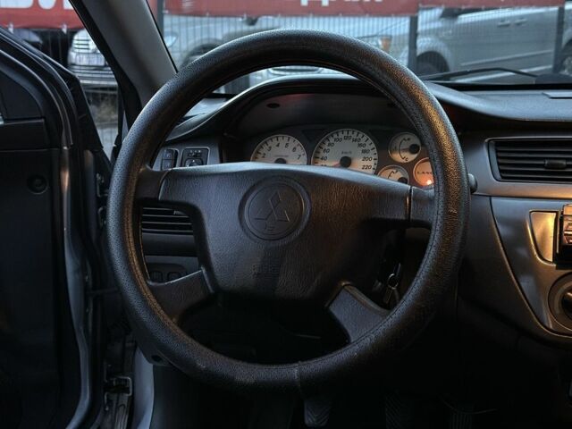 Серый Мицубиси Лансер, объемом двигателя 1.6 л и пробегом 220 тыс. км за 3999 $, фото 13 на Automoto.ua