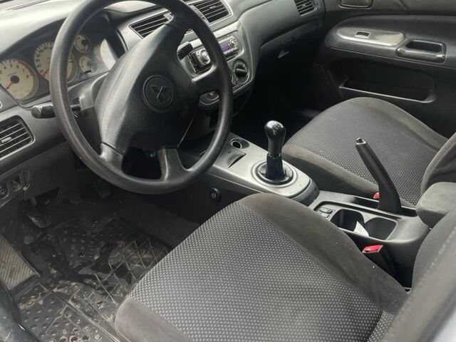 Сірий Міцубісі Lancer, об'ємом двигуна 1.6 л та пробігом 396 тис. км за 3250 $, фото 5 на Automoto.ua