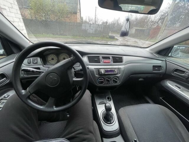 Сірий Міцубісі Lancer, об'ємом двигуна 1.6 л та пробігом 396 тис. км за 3250 $, фото 7 на Automoto.ua