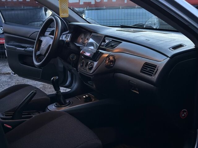 Серый Мицубиси Лансер, объемом двигателя 1.6 л и пробегом 220 тыс. км за 3999 $, фото 10 на Automoto.ua