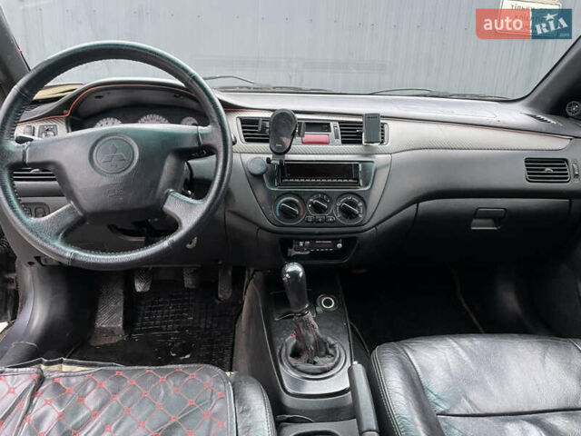 Серый Мицубиси Лансер, объемом двигателя 1.6 л и пробегом 667 тыс. км за 2999 $, фото 6 на Automoto.ua