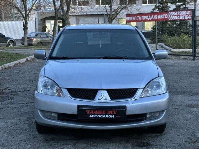 Серый Мицубиси Лансер, объемом двигателя 1.6 л и пробегом 220 тыс. км за 3999 $, фото 3 на Automoto.ua