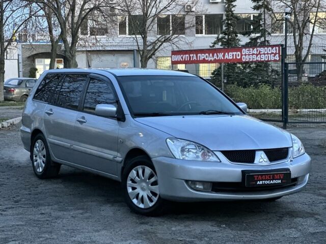 Серый Мицубиси Лансер, объемом двигателя 1.6 л и пробегом 220 тыс. км за 3999 $, фото 5 на Automoto.ua