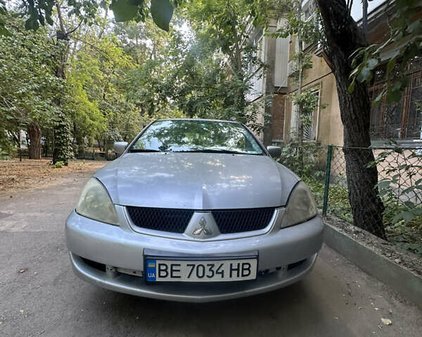 Серый Мицубиси Лансер, объемом двигателя 1.58 л и пробегом 278 тыс. км за 4700 $, фото 1 на Automoto.ua