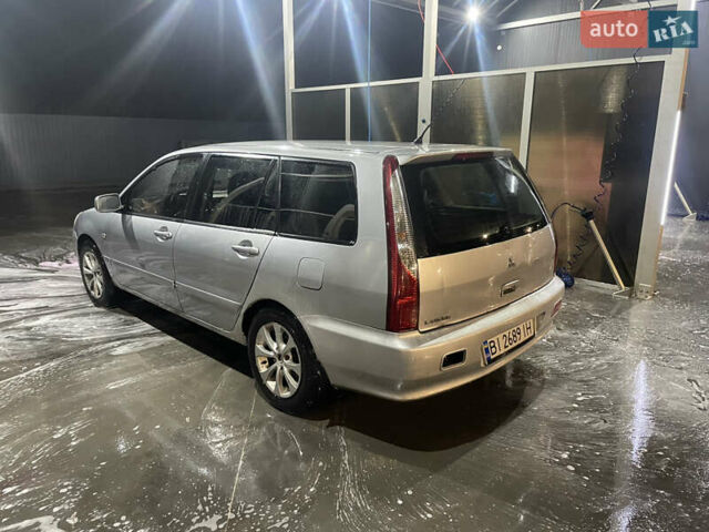 Сірий Міцубісі Lancer, об'ємом двигуна 1.6 л та пробігом 396 тис. км за 2900 $, фото 13 на Automoto.ua