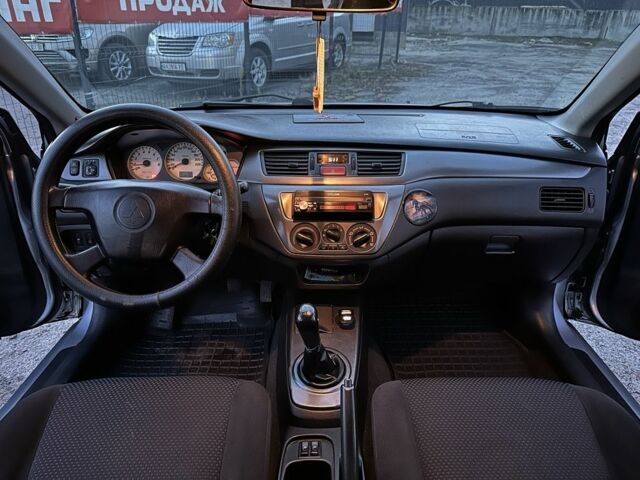 Серый Мицубиси Лансер, объемом двигателя 1.6 л и пробегом 220 тыс. км за 3999 $, фото 12 на Automoto.ua