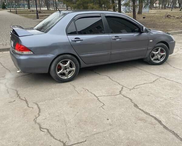 Сірий Міцубісі Lancer, об'ємом двигуна 1.6 л та пробігом 280 тис. км за 4200 $, фото 2 на Automoto.ua