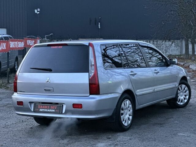 Серый Мицубиси Лансер, объемом двигателя 1.6 л и пробегом 220 тыс. км за 3999 $, фото 1 на Automoto.ua