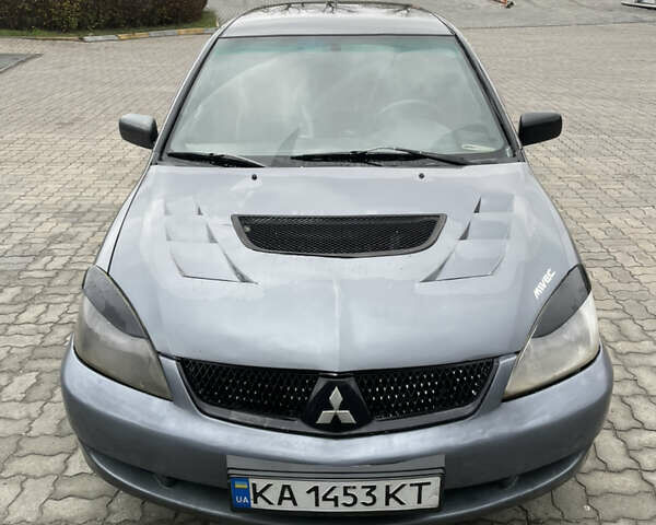 Серый Мицубиси Лансер, объемом двигателя 1.6 л и пробегом 667 тыс. км за 2999 $, фото 2 на Automoto.ua