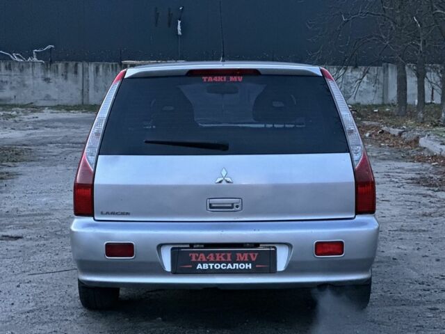 Серый Мицубиси Лансер, объемом двигателя 1.6 л и пробегом 220 тыс. км за 3999 $, фото 2 на Automoto.ua