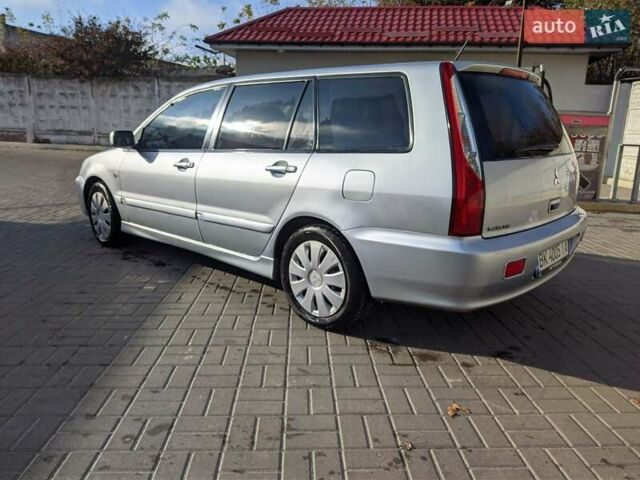 Сірий Міцубісі Lancer, об'ємом двигуна 1.58 л та пробігом 220 тис. км за 4499 $, фото 18 на Automoto.ua