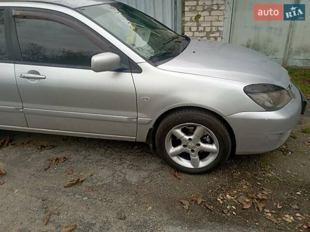 Серый Мицубиси Лансер, объемом двигателя 1.6 л и пробегом 350 тыс. км за 3000 $, фото 8 на Automoto.ua