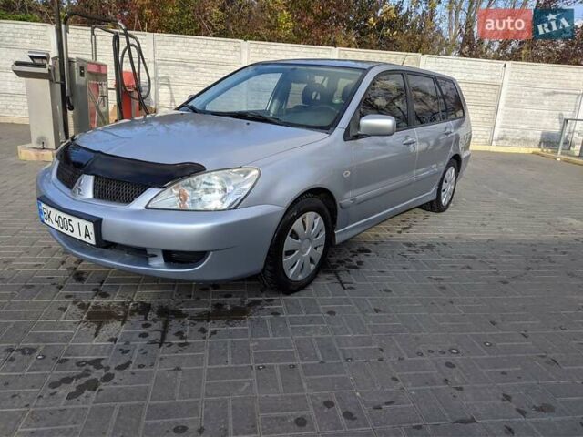 Сірий Міцубісі Lancer, об'ємом двигуна 1.58 л та пробігом 220 тис. км за 4499 $, фото 3 на Automoto.ua