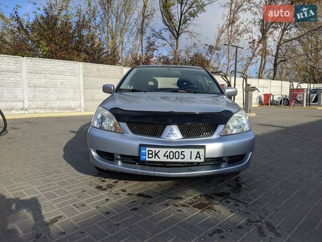 Сірий Міцубісі Lancer, об'ємом двигуна 1.58 л та пробігом 220 тис. км за 4499 $, фото 1 на Automoto.ua