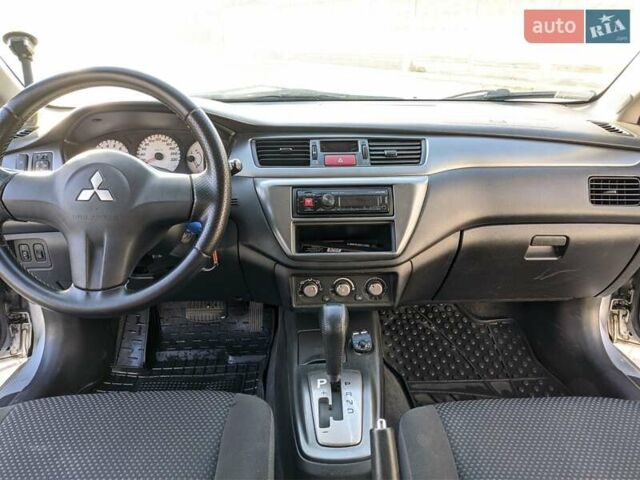 Сірий Міцубісі Lancer, об'ємом двигуна 1.58 л та пробігом 220 тис. км за 4499 $, фото 28 на Automoto.ua