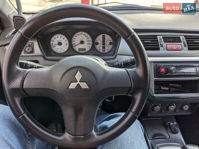 Сірий Міцубісі Lancer, об'ємом двигуна 1.58 л та пробігом 220 тис. км за 4499 $, фото 26 на Automoto.ua