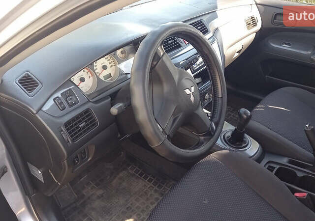 Серый Мицубиси Лансер, объемом двигателя 1.58 л и пробегом 296 тыс. км за 3850 $, фото 3 на Automoto.ua