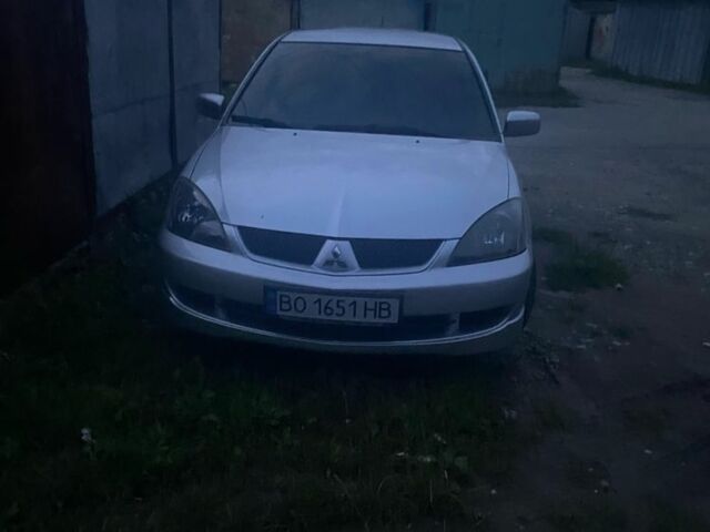 Серый Мицубиси Лансер, объемом двигателя 2 л и пробегом 250 тыс. км за 4058 $, фото 3 на Automoto.ua