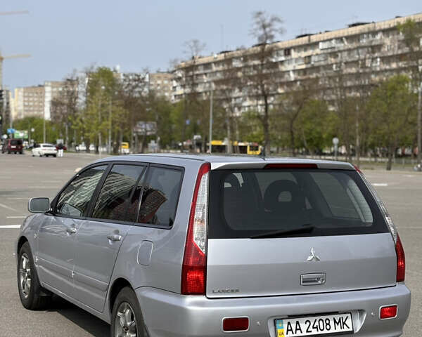 Серый Мицубиси Лансер, объемом двигателя 1.58 л и пробегом 245 тыс. км за 4600 $, фото 4 на Automoto.ua