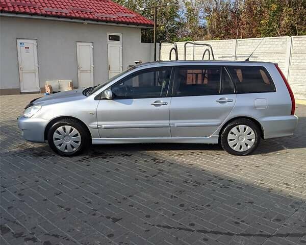 Сірий Міцубісі Lancer, об'ємом двигуна 1.58 л та пробігом 220 тис. км за 4499 $, фото 8 на Automoto.ua