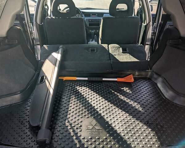 Сірий Міцубісі Lancer, об'ємом двигуна 1.58 л та пробігом 220 тис. км за 4499 $, фото 39 на Automoto.ua
