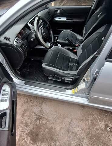 Серый Мицубиси Лансер, объемом двигателя 1.58 л и пробегом 223 тыс. км за 3200 $, фото 4 на Automoto.ua