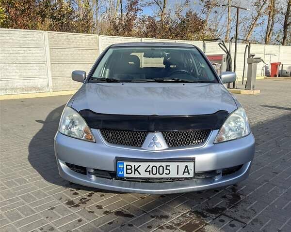 Сірий Міцубісі Lancer, об'ємом двигуна 1.58 л та пробігом 220 тис. км за 4499 $, фото 2 на Automoto.ua