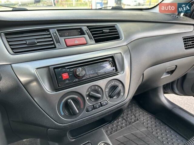 Сірий Міцубісі Lancer, об'ємом двигуна 1.59 л та пробігом 279 тис. км за 4999 $, фото 28 на Automoto.ua
