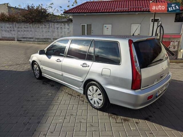 Сірий Міцубісі Lancer, об'ємом двигуна 1.58 л та пробігом 220 тис. км за 4499 $, фото 19 на Automoto.ua