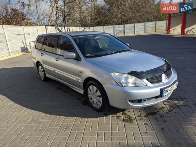 Сірий Міцубісі Lancer, об'ємом двигуна 1.58 л та пробігом 220 тис. км за 4499 $, фото 10 на Automoto.ua