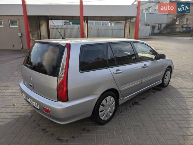 Сірий Міцубісі Lancer, об'ємом двигуна 1.58 л та пробігом 220 тис. км за 4499 $, фото 16 на Automoto.ua