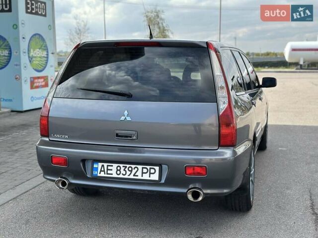 Сірий Міцубісі Lancer, об'ємом двигуна 1.59 л та пробігом 279 тис. км за 4999 $, фото 19 на Automoto.ua