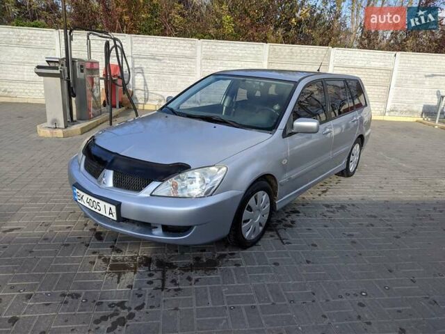 Сірий Міцубісі Lancer, об'ємом двигуна 1.58 л та пробігом 220 тис. км за 4499 $, фото 5 на Automoto.ua