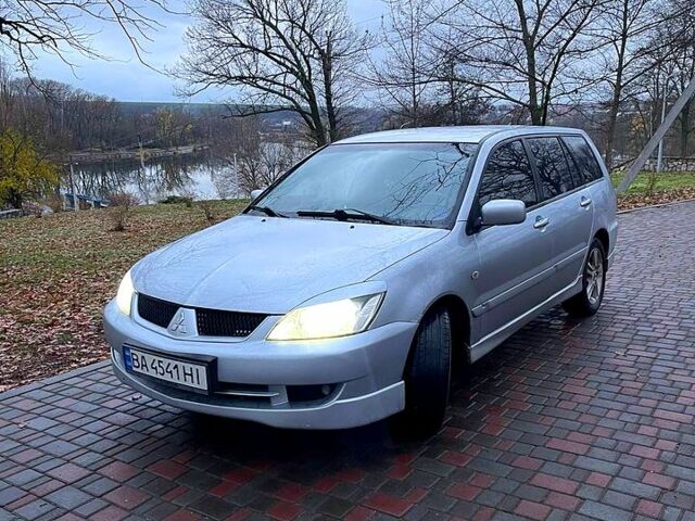 Серый Мицубиси Лансер, объемом двигателя 2 л и пробегом 346 тыс. км за 3900 $, фото 3 на Automoto.ua